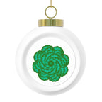 Round white ornament with a green floral pattern and gold accent on a white background