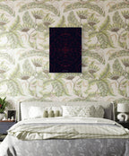 Bedroom with floral wallpaper and a framed picture on the wall.