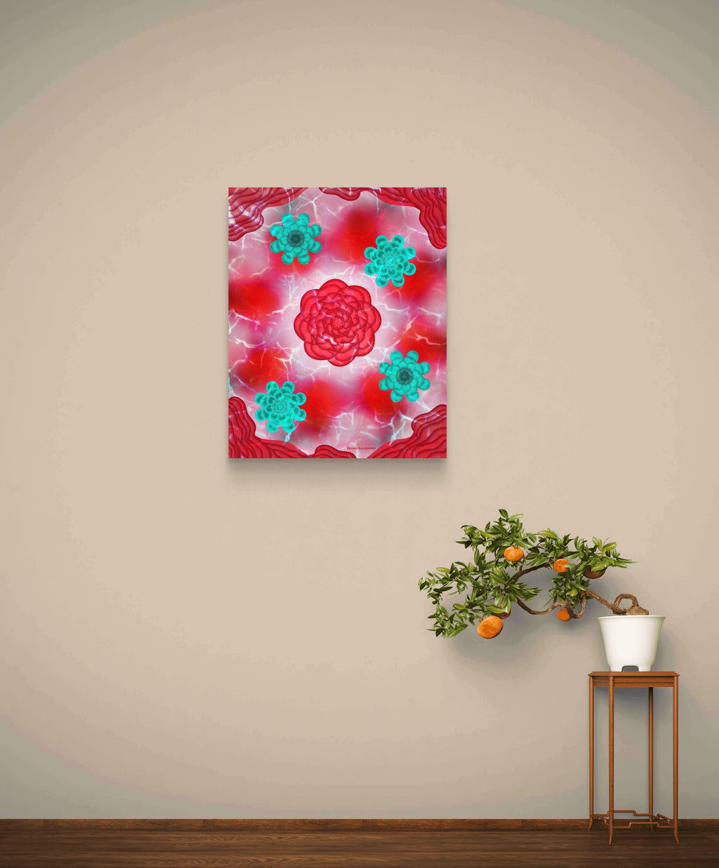 red and teal floral art print displayed on a cream coloured wall with a small tangerine plant below on a stool