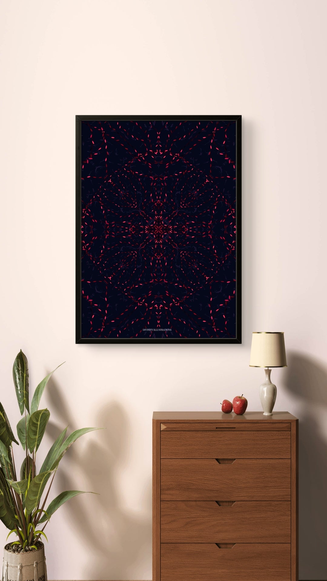 Framed abstract art print on a wall above a wooden cabinet with a lamp and decorative items.