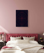 Bedroom with pink headboard and abstract art on wall